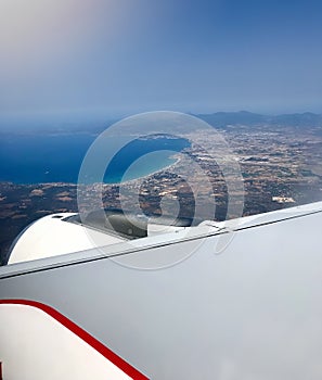 Airplane Window With Wing And clear Sky near Palma de Majorca Airport