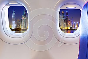 Airplane windows with Dubai skyscrapers view