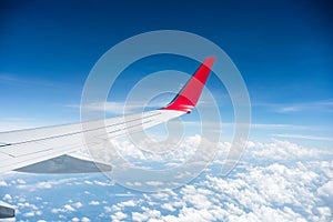 Airplane wing above the clouds