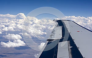 Airplane wing above the clouds