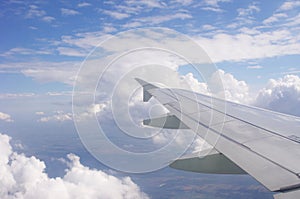 Airplane wing and blue sky