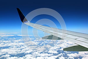 Airplane wing with blue sky