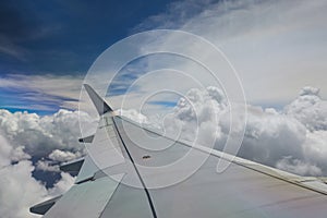 Airplane wing on blue sky