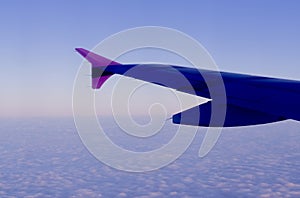 Airplane  wing on blue  sky background