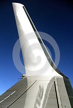 Airplane wing with blue sky in the background stock photo