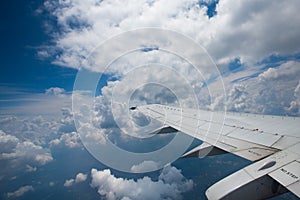 Airplane wing and clouds