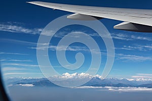 Airplane wing with Everest mount landscape viewed