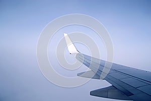 Airplane wing. Flight in the sky