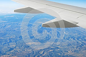 Airplane wing and landscape photo