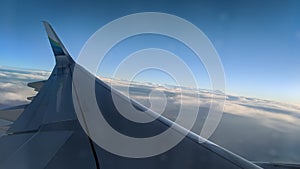 Airplane wing seen from inside the plane during flight