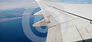 airplane wing while traveling with blue sky. flight concept