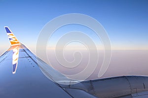 Airplane wing with turbina in the air.