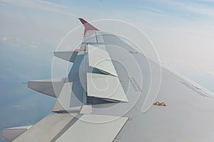 Airplane wing view from the passenger seat.