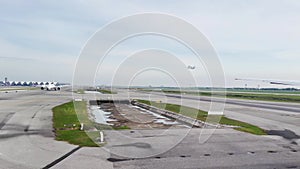 Airplane wing, view from the window, waiting to take off at the airport, other planes lined up