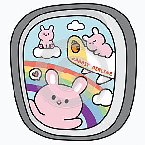 Airplane wing from window.Sky rainbow view on seat side windows plane.Rabbit