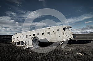 Airplane wreckage Solheimasandur Iceland on black sand beach