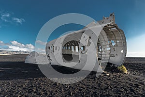 Airplane wreckage Solheimasandur Iceland on black sand beach