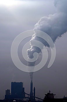 Airpollution on the Maasvlakte, seen from accross the Waterweg photo