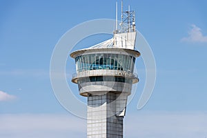 Airport air traffic control tower. Flights management center. Isolated blue sky background
