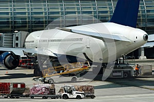 Airport, airplane, loading cargo.