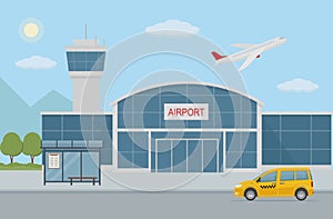 Airport building, taxi cab and bus stop.