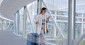 Airport, business woman and phone text with luggage for company travel and commute. Suitcase, mobile networking and