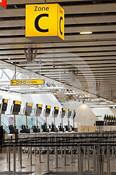 Airport Check in Desks and Zone C Sign