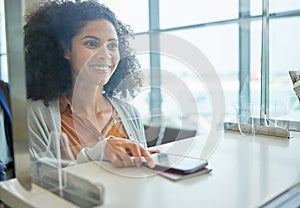 Airport counter, black woman and phone at ticket desk with happiness from travel and vacation. Air traveling customs photo