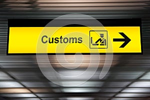 Airport customs declare sign with icon and arrow hanging photo