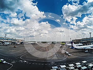 Airport Domodedovo in Moscow with airplanes and beautiful cloudy sky