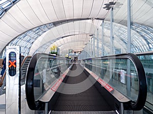 Airport escalator In the dome of a high roof.