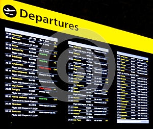 Airport flight information, international departure board displayed on a large digital screen