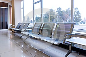 Airport gate waiting area with metal seats