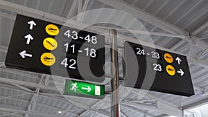 Airport gates signs with different directions