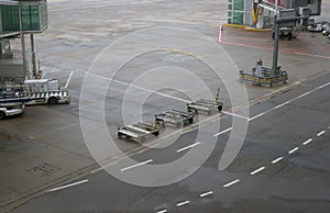 Airport ground vehicles ready for an airplane