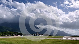 Airport infrastructure with runways at the foot of the misty mountains