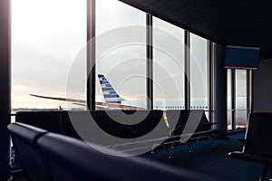 Airport lounge with background view of airplane through window