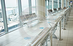 Airport, lounge chairs and terminal waiting room for global travel, covid regulations or immigration journey. Empty