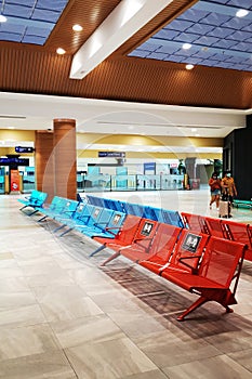 Airport Lounge, Seating Benches Lined Through One Seat. Social distancing, safety measures in the era of coronavirus