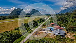 Airport at Mulu village surrounded by tropical forest and mountains near Gunung Mulu national park. Borneo. Sarawak.