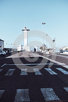 An airport outdoor area with a tower