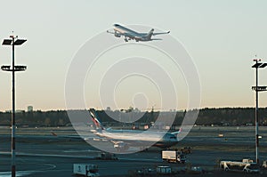 Airport, the plane on takeoff, airplanes at beautiful sunset