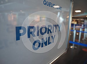 Airport priority only queue here sign