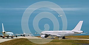 Busy airport, airplanes  in runway queue photo