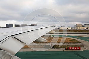Wing of plane seen from inside plane