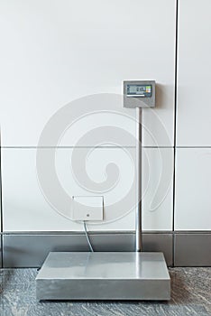 An airport self service check in booth/kiosk with attached baggage scales