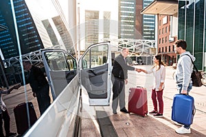 Airport Shuttle driver and passengers in a big city