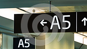 Airport sign in black for gate A5