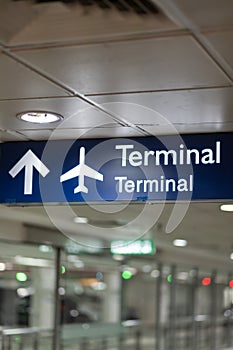 airport sign showing the way to the airport terminal building