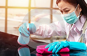 Airport staff wearing hygienic face mask make cleaning and disinfection for good hygiene around airport photo